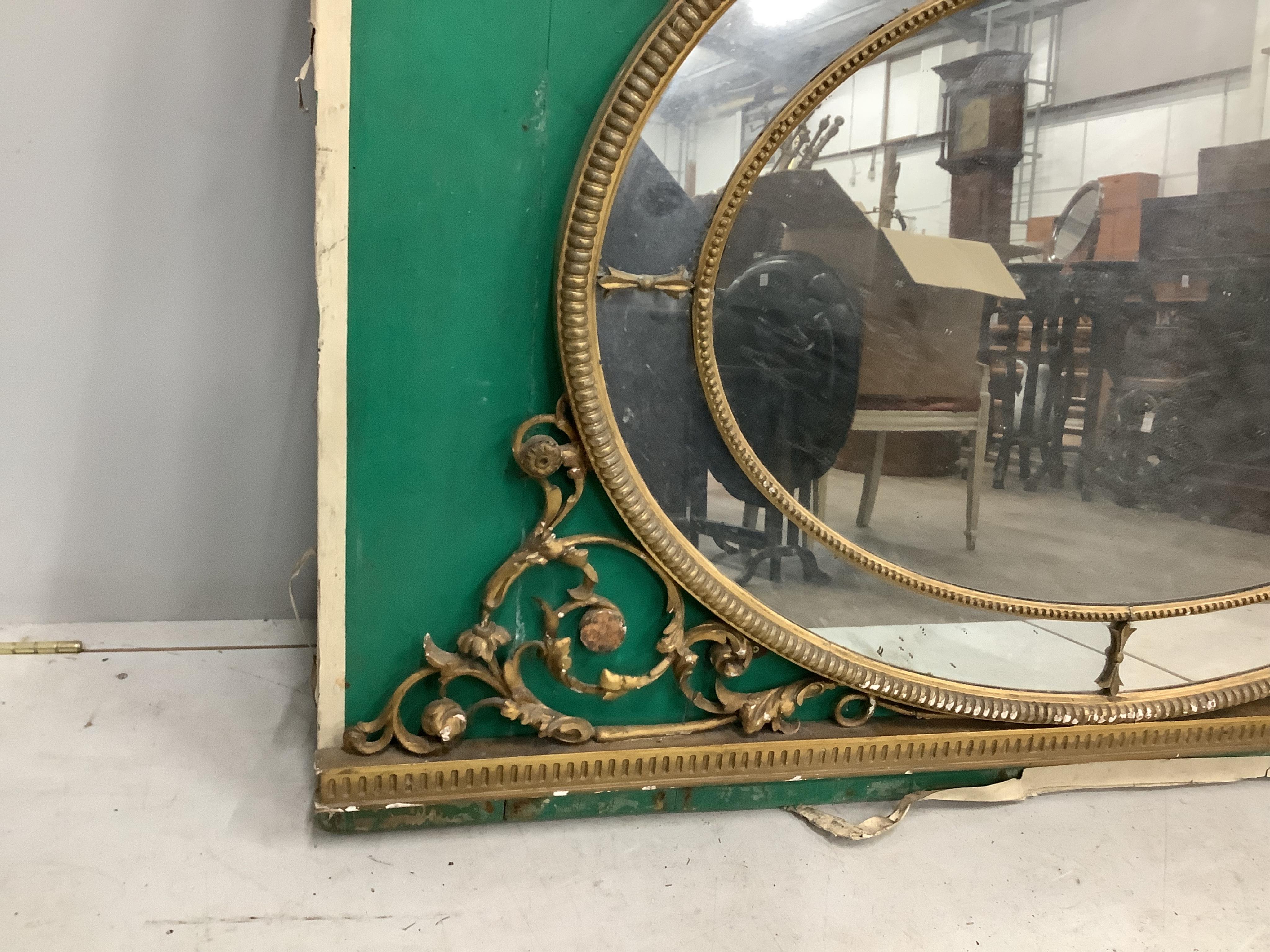 A Victorian oval giltwood and composition wall mirror, width 152cm, height 157cm. Condition - poor to fair